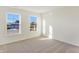 Spacious bedroom with neutral walls, carpet and two windows at 5856 Fair Oak Cir, Brownsburg, IN 46112