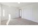 Bright bedroom with neutral walls, carpet and door to hallway at 5856 Fair Oak Cir, Brownsburg, IN 46112