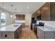 Modern kitchen with stainless steel appliances and granite countertops at 5856 Fair Oak Cir, Brownsburg, IN 46112
