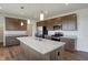 Modern kitchen with stainless steel appliances and granite countertops at 5856 Fair Oak Cir, Brownsburg, IN 46112