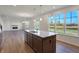 Kitchen island overlooks Gathering room and has granite countertops at 5856 Fair Oak Cir, Brownsburg, IN 46112
