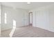 Bright bedroom with neutral walls, carpet and door to hallway at 5856 Fair Oak Cir, Brownsburg, IN 46112