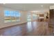 Open concept living room with hardwood floors and kitchen view at 5856 Fair Oak Cir, Brownsburg, IN 46112