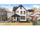 Renovated two-story house with a new fence and landscaping at 631 Cottage Ave, Indianapolis, IN 46203