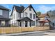 White house with black accents and a wood fence at 631 Cottage Ave, Indianapolis, IN 46203
