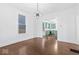 Bright dining room with hardwood floors and kitchen view at 631 Cottage Ave, Indianapolis, IN 46203