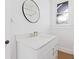 Bathroom with white vanity and quartz countertop at 631 Cottage Ave, Indianapolis, IN 46203