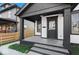 Front porch with concrete flooring and black columns at 631 Cottage Ave, Indianapolis, IN 46203