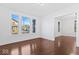 Bright living room with hardwood floors and large windows at 631 Cottage Ave, Indianapolis, IN 46203