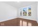 Spacious bedroom with hardwood floors and large windows at 631 Cottage Ave, Indianapolis, IN 46203