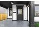 Black front door with glass panel and sidelights at 631 Cottage Ave, Indianapolis, IN 46203