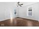 Light-filled bedroom with hardwood floors, ceiling fan and white walls at 631 Cottage Ave, Indianapolis, IN 46203