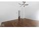 Spacious bedroom with hardwood floors, ceiling fan and access to hallway at 631 Cottage Ave, Indianapolis, IN 46203