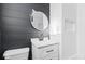 Updated bathroom with subway tile and white vanity at 631 Cottage Ave, Indianapolis, IN 46203