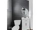 Modern bathroom with dark-grey shiplap and white vanity at 631 Cottage Ave, Indianapolis, IN 46203