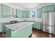 Updated kitchen with island and stainless steel appliances at 631 Cottage Ave, Indianapolis, IN 46203