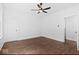 Bright bedroom with hardwood floors, ceiling fan, and window at 631 Cottage Ave, Indianapolis, IN 46203
