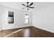 Charming bedroom with hardwood floors, neutral walls, and large windows at 631 Cottage Ave, Indianapolis, IN 46203