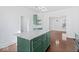 Island kitchen with granite countertop and green cabinets at 631 Cottage Ave, Indianapolis, IN 46203
