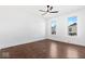 Bright bedroom with hardwood floors, ceiling fan, and large windows at 631 Cottage Ave, Indianapolis, IN 46203