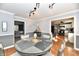 Elegant dining room with gray walls and a round table with seating for four at 743 Lawrence Ave, Indianapolis, IN 46227