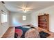 Finished basement with hardwood floors, ceiling fan, and built-in shelving at 104 Mohawk Ln, West Lafayette, IN 47906
