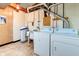 Unfinished basement laundry room with washer, dryer, and utility sink at 104 Mohawk Ln, West Lafayette, IN 47906