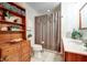 Clean bathroom with shower/tub and wood vanity at 104 Mohawk Ln, West Lafayette, IN 47906