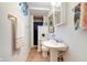 Basement bathroom with pedestal sink, shower, and updated vanity at 104 Mohawk Ln, West Lafayette, IN 47906