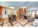 Bright dining area with tile floor and kitchen view at 104 Mohawk Ln, West Lafayette, IN 47906