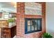 Brick fireplace with glass doors and modern design at 104 Mohawk Ln, West Lafayette, IN 47906