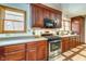 Modern kitchen with stainless steel appliances and wood cabinets at 104 Mohawk Ln, West Lafayette, IN 47906