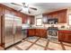 Updated kitchen with stainless steel appliances and wood cabinets at 104 Mohawk Ln, West Lafayette, IN 47906