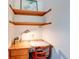 Cozy study with floating shelves and a comfortable wooden desk and chair at 104 Mohawk Ln, West Lafayette, IN 47906