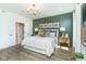 Main bedroom featuring a large bed and en-suite bathroom at 18322 Depoe Ln, Westfield, IN 46074