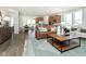 Open concept living room featuring a leather couch and hardwood floors at 18322 Depoe Ln, Westfield, IN 46074