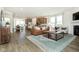 Open concept living area with fireplace and hardwood floors at 18322 Depoe Ln, Westfield, IN 46074
