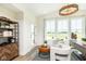 Home office with built-in shelving and hardwood floors at 18322 Depoe Ln, Westfield, IN 46074