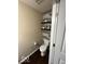 Small bathroom with a toilet and floating shelves at 9130 Tansel Crk Dr, Indianapolis, IN 46234