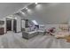 Spacious bonus room featuring a sectional sofa and large teddy bear at 1117 Sarah Ct, Greenwood, IN 46142