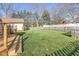 Spacious backyard with a deck and wooden fence at 595 Hawthorne Dr, Carmel, IN 46033