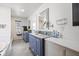 Modern bathroom with double vanity and updated fixtures at 595 Hawthorne Dr, Carmel, IN 46033