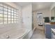 Bathroom featuring a large soaking tub and separate shower at 595 Hawthorne Dr, Carmel, IN 46033
