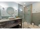Updated bathroom with a walk-in shower and modern vanity at 595 Hawthorne Dr, Carmel, IN 46033