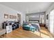 Main bedroom with large windows and light wood floors at 595 Hawthorne Dr, Carmel, IN 46033