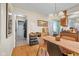 Bright dining area with wood floors and access to kitchen at 595 Hawthorne Dr, Carmel, IN 46033