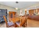 Dining area with kitchen views, wood table, and built-in hutch at 595 Hawthorne Dr, Carmel, IN 46033