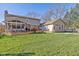 Large backyard with a two-story house and deck at 595 Hawthorne Dr, Carmel, IN 46033