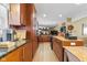 Modern kitchen with light wood cabinets and granite countertops at 595 Hawthorne Dr, Carmel, IN 46033