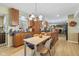 Open concept kitchen with breakfast bar and dining area at 595 Hawthorne Dr, Carmel, IN 46033